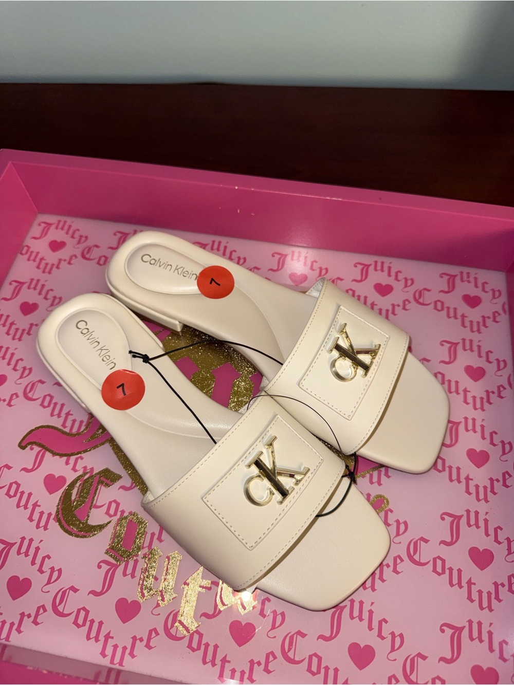 Calvin Klein Cream Slide Mules with Gold CK Emblem